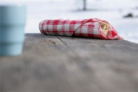 Sandwich lying on a wooden table Stock Photo - Premium Royalty-Free, Code: 628-00919485