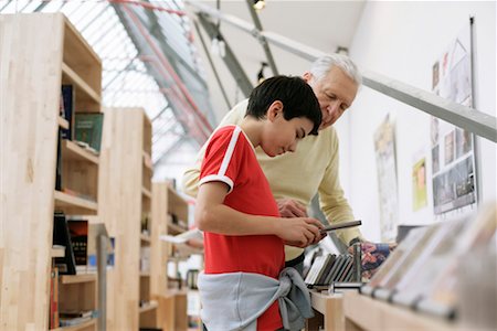simsearch:628-00919621,k - Grandfather and boy choosing CDs, fully_released Stock Photo - Premium Royalty-Free, Code: 628-00919609