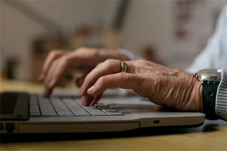 Senior man using a laptop, fully_released Stock Photo - Premium Royalty-Free, Code: 628-00919614