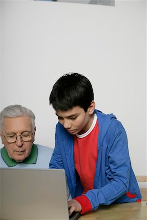 Grandfather and boy using a laptop, fully_released Stock Photo - Premium Royalty-Free, Code: 628-00919616
