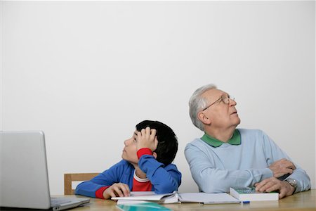 simsearch:628-00919621,k - Dissatisfied boy and grandfather sitting back to back, fully_released Stock Photo - Premium Royalty-Free, Code: 628-00919619