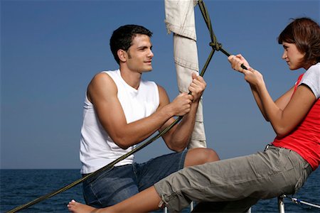 friends sailing - Couple pulling a rope Stock Photo - Premium Royalty-Free, Code: 628-00919944