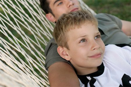 simsearch:694-03328242,k - Father and son lying together in a hammock Stock Photo - Premium Royalty-Free, Code: 628-00919973