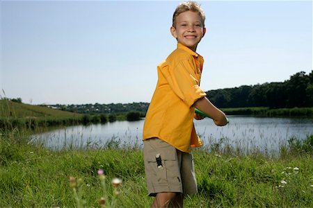 short boy kids - Boy throwing frisbee Stock Photo - Premium Royalty-Free, Code: 628-00919989