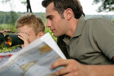 simsearch:628-00919973,k - Father holding world map while his son is looking through binoculars Stock Photo - Premium Royalty-Free, Code: 628-00920051