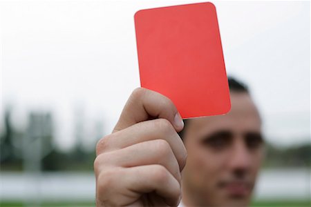 Referee hand(red card) Stock Photo