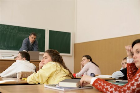 simsearch:628-00920637,k - Bored pupils looking out of a window, teacher in front of a blackboard Stock Photo - Premium Royalty-Free, Code: 628-00920586