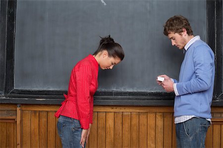 picture of man with red bow - Asian woman bowing in front of a Caucasian man Stock Photo - Premium Royalty-Free, Code: 628-01278283