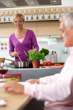 simsearch:628-01279142,k - Blonde woman is making dinner for herself and her husband, selective focus Foto de stock - Royalty Free Premium, Número: 628-01278372