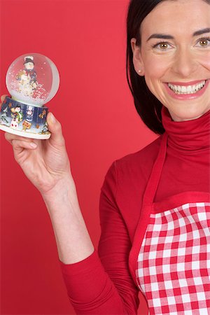 snowglobe - Woman holding a snow dome Stock Photo - Premium Royalty-Free, Code: 628-01278712