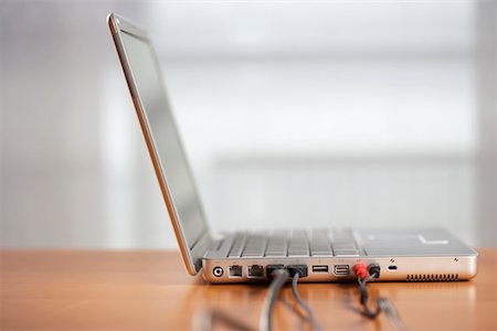 Laptop on a table Stock Photo - Premium Royalty-Free, Code: 628-01279518