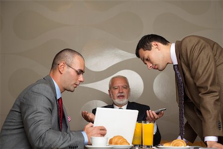 simsearch:628-01278542,k - Three businessmen having a meeting Stock Photo - Premium Royalty-Free, Code: 628-01279621