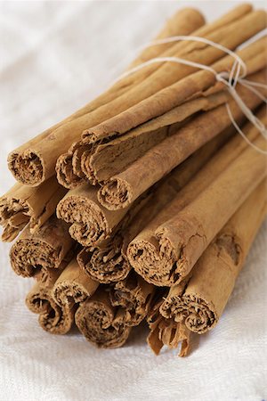 smelling spices - Bunch of cinnamon sticks Stock Photo - Premium Royalty-Free, Code: 628-01495070