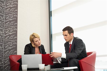 simsearch:628-01495138,k - Two businesspeople having a meeting Stock Photo - Premium Royalty-Free, Code: 628-01495133