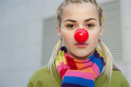 Young woman wearing red nose Fotografie stock - Premium Royalty-Free, Codice: 628-01495284
