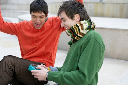 Two young men playing computer game Stock Photo - Premium Royalty-Free, Code: 628-01495296