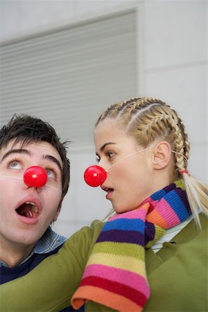 Young couple wearing red noses Fotografie stock - Premium Royalty-Free, Codice: 628-01495342