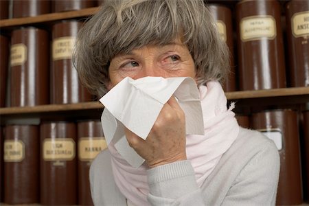 Sick woman blowing nose Stock Photo - Premium Royalty-Free, Code: 628-01586587