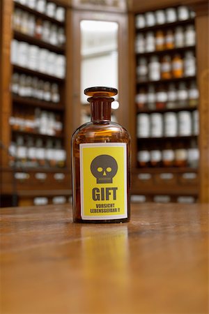 Brown bottle with poison sign Stock Photo - Premium Royalty-Free, Code: 628-01586580