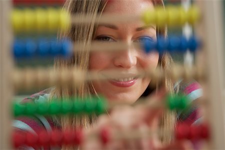 simsearch:628-01586779,k - A woman behind a slide rule Stock Photo - Premium Royalty-Free, Code: 628-01586735