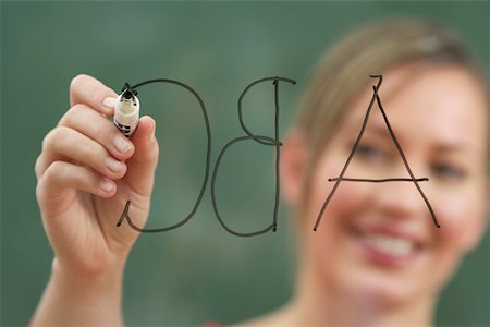 spell - Woman is writing on an glass board Stock Photo - Premium Royalty-Free, Code: 628-01586767