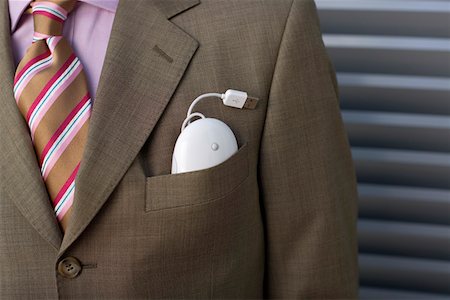 Computer mouse in businessman's pocket Stock Photo - Premium Royalty-Free, Code: 628-01639023
