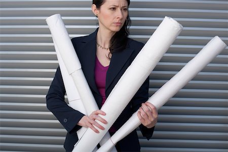 simsearch:628-01639098,k - Businesswoman holding several paper rolls Stock Photo - Premium Royalty-Free, Code: 628-01639031