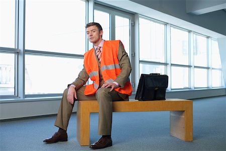 simsearch:640-02950510,k - Homme d'affaires porte un gilet réfléchissant Photographie de stock - Premium Libres de Droits, Code: 628-01639046