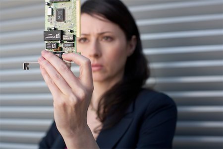 simsearch:628-01639098,k - Businesswoman holding a circuit board Stock Photo - Premium Royalty-Free, Code: 628-01639058