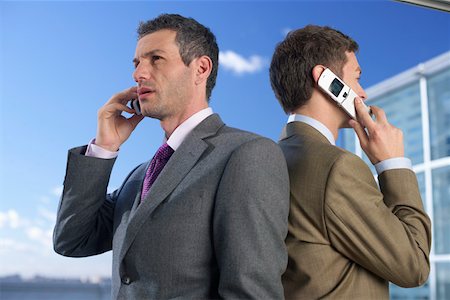 simsearch:628-01639078,k - Two businessmen phoning with mobile phones Foto de stock - Sin royalties Premium, Código: 628-01639064