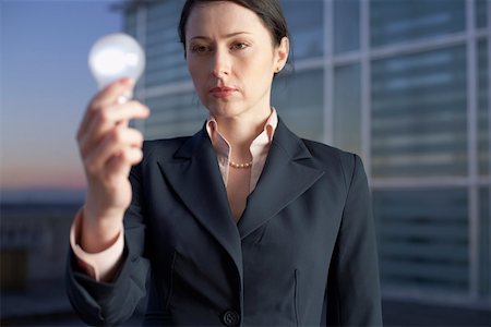simsearch:628-01639098,k - Businesswoman holding an electric bulb Stock Photo - Premium Royalty-Free, Code: 628-01639111