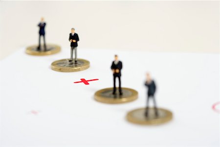 simsearch:628-01712179,k - Plus sign between businessmen figurines standing on one Euro coins Stock Photo - Premium Royalty-Free, Code: 628-01712171