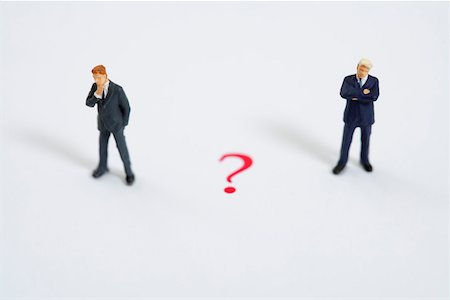 simsearch:628-01712179,k - Question mark between businessmen figurines Stock Photo - Premium Royalty-Free, Code: 628-01712184