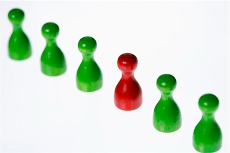 simsearch:628-01712179,k - Red game piece standing between green ones Stock Photo - Premium Royalty-Free, Code: 628-01712212