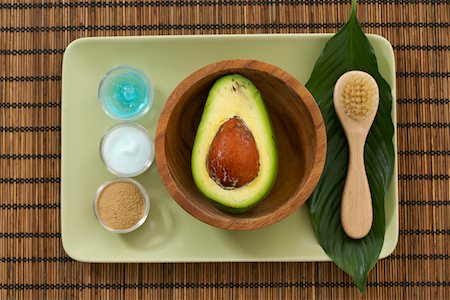 facial mask brush - Dishes with several lotions and a half avocado Stock Photo - Premium Royalty-Free, Code: 628-01712273