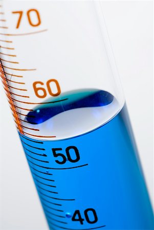 A test tube with measuring scale and blue liquid Stock Photo - Premium Royalty-Free, Code: 628-01836741