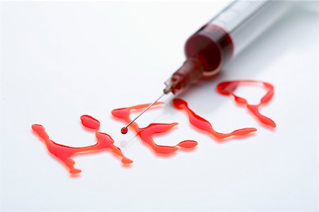 Red written word HELP and a syringe Stock Photo - Premium Royalty-Free, Code: 628-01836767