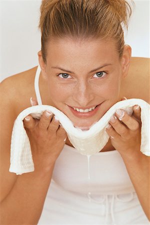 Young woman cleaning face Stock Photo - Premium Royalty-Free, Code: 628-02062612