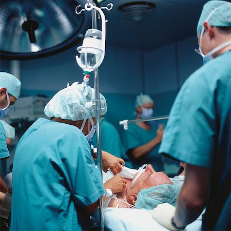 Surgical team performing operation Stock Photo - Premium Royalty-Free, Code: 628-02062649