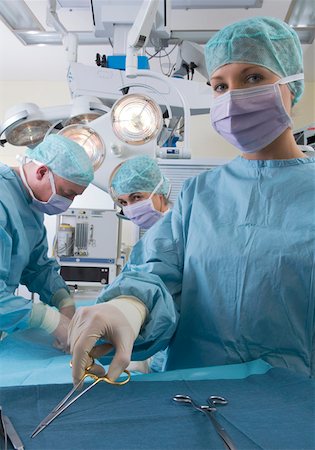Surgical team performing operation Stock Photo - Premium Royalty-Free, Code: 628-02062696