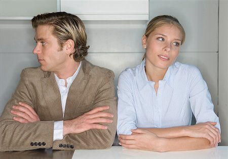 Couple sitting side by side, looking away Stock Photo - Premium Royalty-Free, Code: 628-02062731