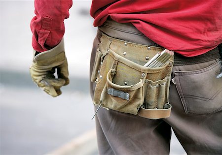 Construction worker wearing tool belt Stock Photo - Premium Royalty-Free, Code: 628-02198016