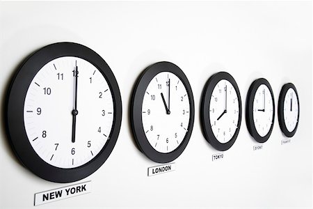 simsearch:628-02198065,k - Wall clocks in line displaying international time Stock Photo - Premium Royalty-Free, Code: 628-02198065