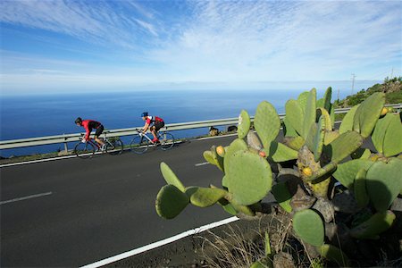 Two racing cycle riders on a country road Stock Photo - Premium Royalty-Free, Code: 628-02228178