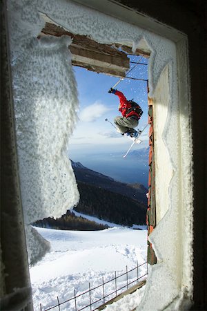 flight window - Skier jumping in front of a broken window Stock Photo - Premium Royalty-Free, Code: 628-02228179