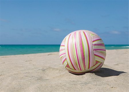 Colorful volleyball at beach Stock Photo - Premium Royalty-Free, Code: 628-02615614