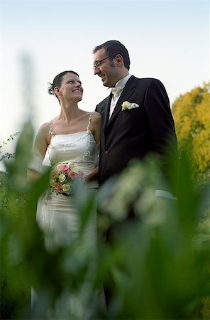simsearch:628-02953999,k - Bridal Couple smiling at each other happily - Idyll - Harmony - Wedding Foto de stock - Sin royalties Premium, Código: 628-02615731