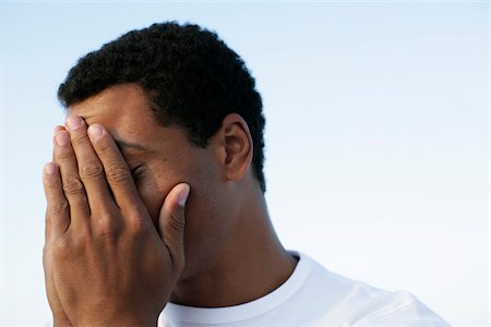 Man covering his face with his hands - Stock Photo - Masterfile - Premium  Royalty-Free, Code: 628-02615890