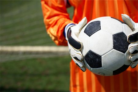 soccer ball closeup - Goalkeeper holding ball Stock Photo - Premium Royalty-Free, Code: 628-02954159