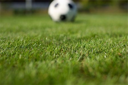soccer ball closeup - Ball lying on grass Stock Photo - Premium Royalty-Free, Code: 628-02954171